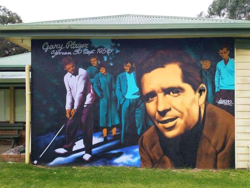 an painting of golfer gary Player on a outside wall of the Yarram Golf Course