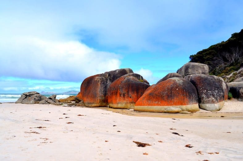 A beach with rocks and white sand at Wilsons Promontory.