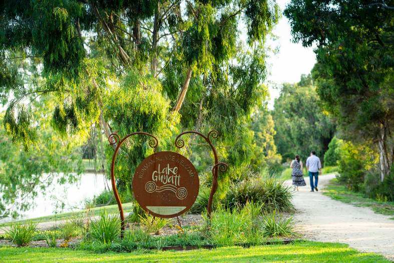 2 people walking on the cultural trail at Lake Guyatt